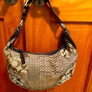 Medium Beautiful Coach Purse. Has numbers, perfect Condition! Brown and Tan